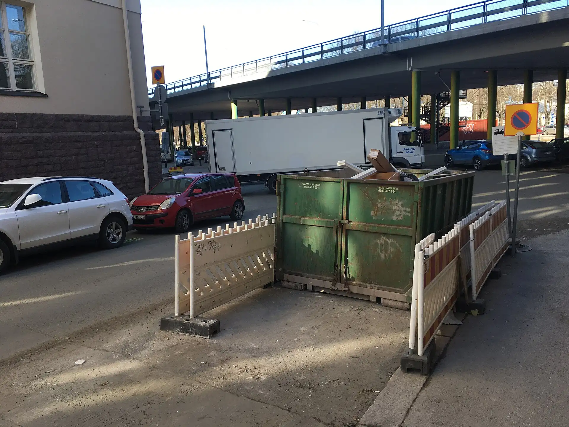 Debris container at a curbside pickup