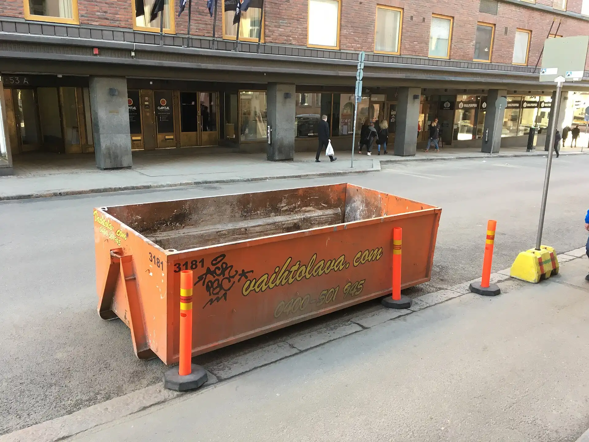 Roll-off dumpster staged on the street for a cleanout